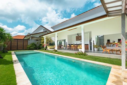 a swimming pool in the backyard of a house at Bingin Villas Luxury, Concierge and Security in Uluwatu