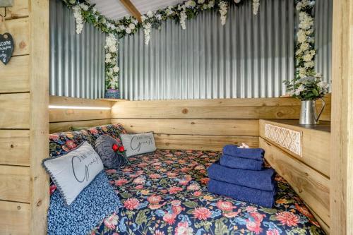 a room with a bed with pillows on it at 1 Bed in Llandovery oc-88603 in Cynghordy