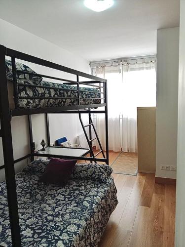 a bedroom with two bunk beds in a room at RiverSide in Barakaldo