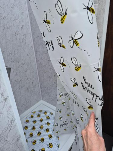 a person holding a box of bees on the wall at Wake up with Wallabies in Par