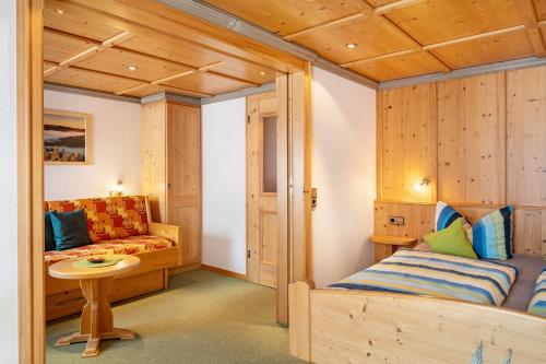 a bedroom with a bed and a couch at Haus Schmid in Lenzkirch