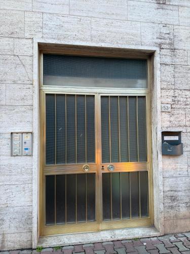 a large glass door on a brick building at A un passo dal mare! in Piombino