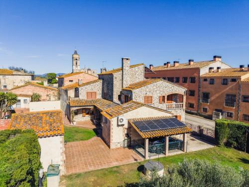 an aerial view of a building with a roof at Cal Ferrer Nou Costa Brava in Riumors