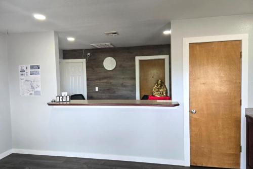 a room with a counter and a mirror at Stay Inn Checotah near Eufaula Lake in Checotah