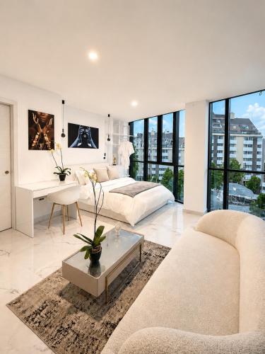 a living room with a couch and a table at NIDO Boutique Hotel in Quito