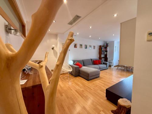 a living room with hands up in the air at Apartamento con encanto in Monte San Miguel