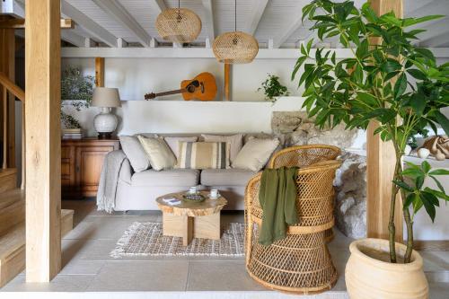 a living room with a couch and a table at Eftihia in Katouna