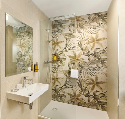 a bathroom with a sink and a shower at Ariel House in Dublin