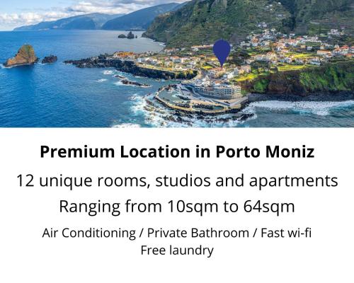 a poster for a town in the ocean with a hot air balloon at The Jolie - Apartments by the Ocean in Porto Moniz