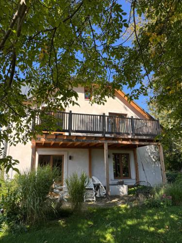 a house with a balcony on top of it at Istebna 401 MURY in Istebna
