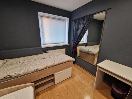 a bedroom with two beds and a mirror at Sitsi apartment in Tallinn