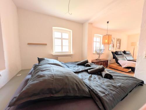 a large bed in a room with a couch at II Bramasole - Sophia L in Spreewitz