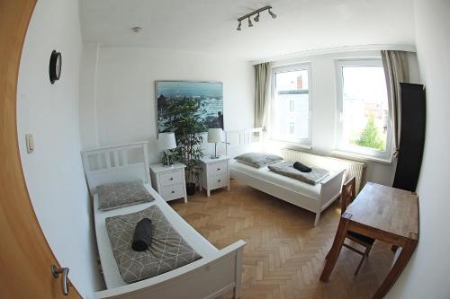 a living room with a couch and a table at Jessop Haus in Lübeck