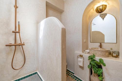 a bathroom with a shower and a sink at Traditional Villa Dar Izza - 4 suite with breakfast in Douar Soukkane