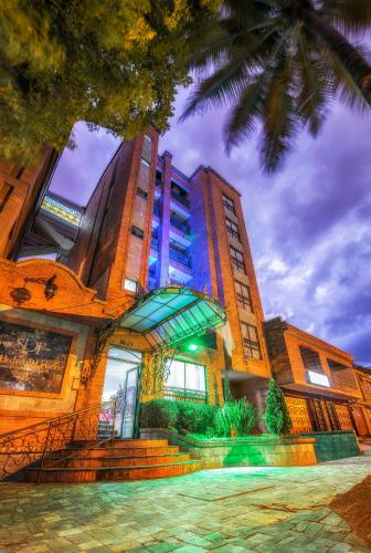 a tall building with a blue light on it at Hotel San Pedro del Fuerte in Medellín