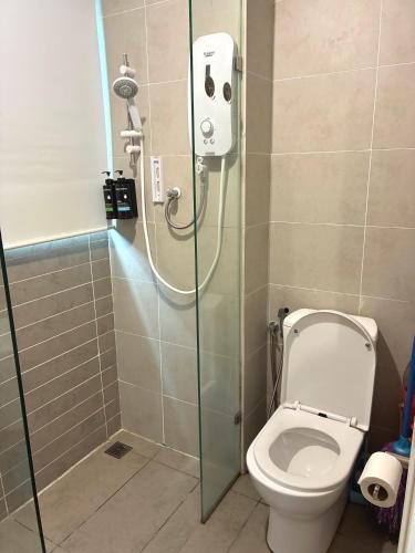 a shower stall with a toilet in a bathroom at Kuching Kozi Square 2paxs Large Window CityView Infinity Pool 2E in Kuching