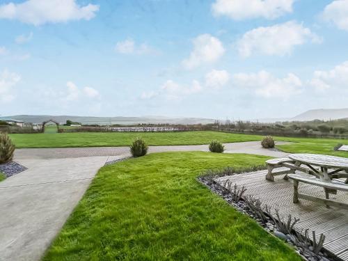 a park with a picnic table and grass at Magnolia Lodge - Uk51603 in Peel