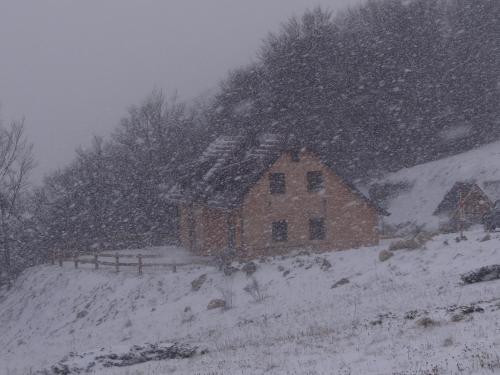a house on a hill in the snow at Vila Dizdarevic Kopaonik in Kopaonik