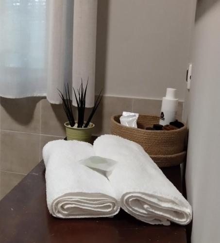 two towels sitting on a table in a bathroom at B&B Galleria 37 in Canosa Sannita