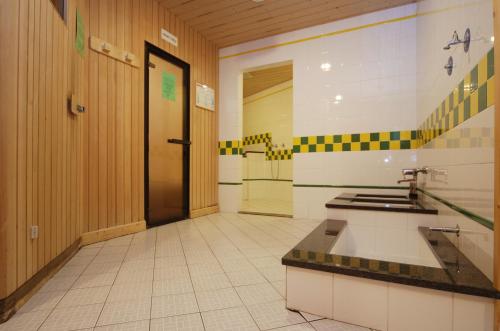 a bathroom with a sink and a counter in a room at Sport Hotel Pampeago in Tesero