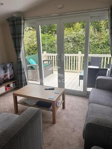 a living room with a couch and a coffee table at 273 Northfield in Skipsea