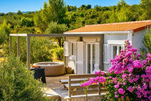 a small house with a tub in the yard at Olive Garden Home with Jacuzzi and Privacy in Mirce