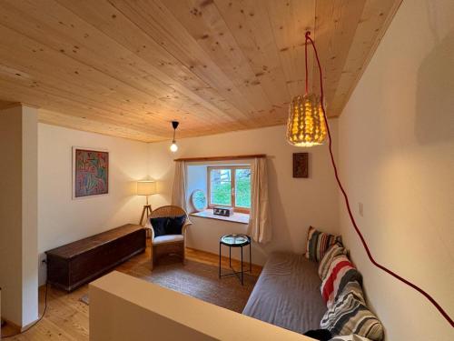 a living room with a couch and a table at Arvenstube - Wergenstein in Wergenstein