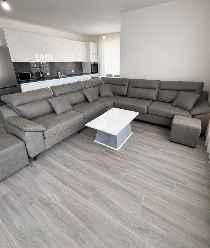 a living room with a couch and a coffee table at Sea View Apartments in Durrës