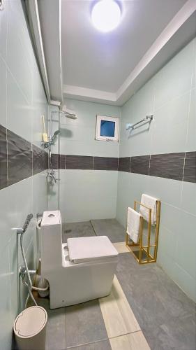 a bathroom with a sink and a toilet in it at La case Dytobi Mermoz in Dakar