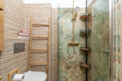 a bathroom with a shower and a toilet at Apartman Miriam in Opatija