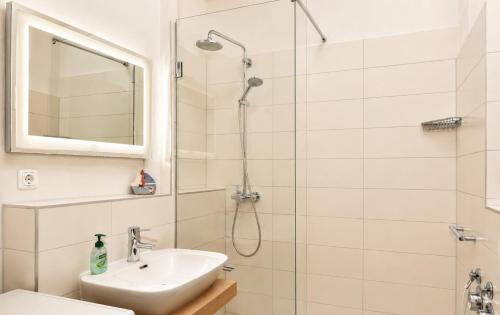 a bathroom with a shower and a sink at Ferienhaus Alisch Fewo 3 in Warnemünde