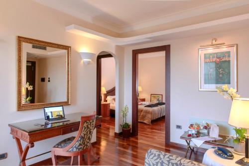 En eller flere senge i et værelse på Hotel Cala Del Porto