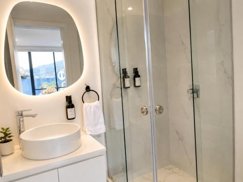 a bathroom with a sink and a shower at NIDO Boutique Hotel in Quito