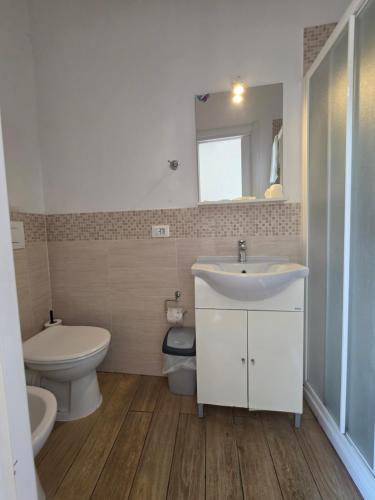 a bathroom with a sink and a toilet at Villa Cristina in Rapallo