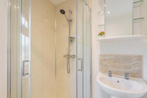 a bathroom with a shower and a sink at 2 Bed in Okehampton oc-80373 in Okehampton