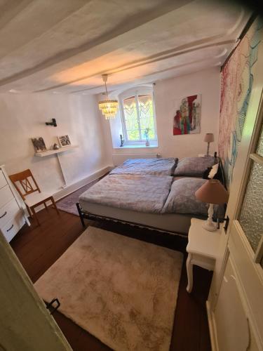 a bedroom with a large bed and a window at Ferienhaus Mia in Neumagen-Dhron