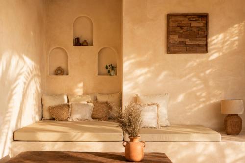 a living room with a couch and a table at Villa Kampung in Gili Islands