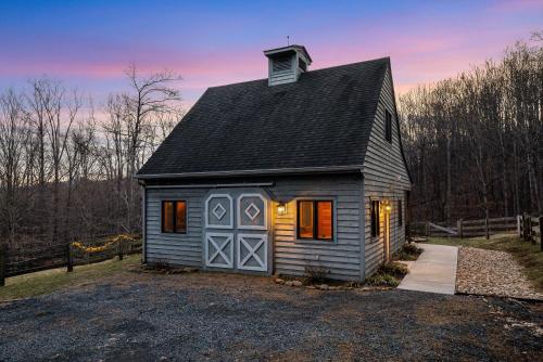 a small gray house with a gambrel roof at Blue's Barn in Nellysford