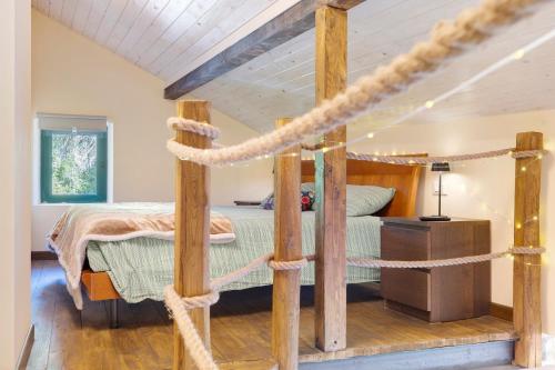 a bedroom with a four poster bed with ropes around it at Villa Piuma in Finale Ligure