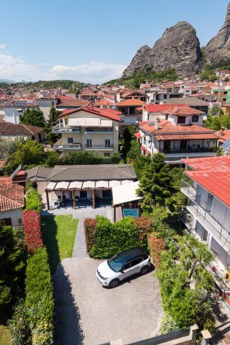 a car parked in the driveway of a house at Meteora boutique villa E in Kalabaka