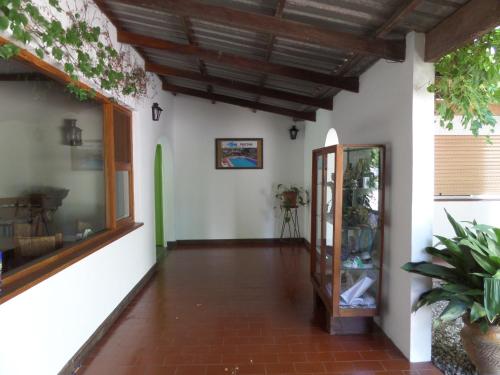 a hallway of a house with a ceiling at Hotel Carmen de Areco in Carmen de Areco