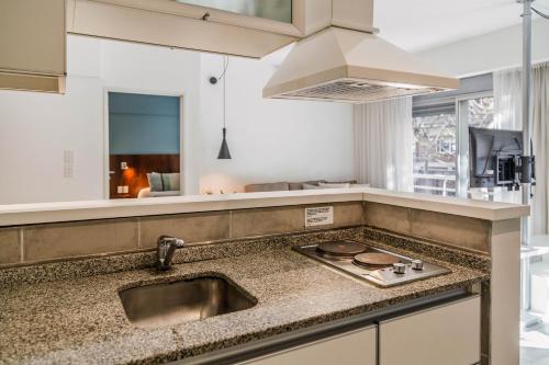 a kitchen with a sink and a counter top at Color Botánico in Buenos Aires