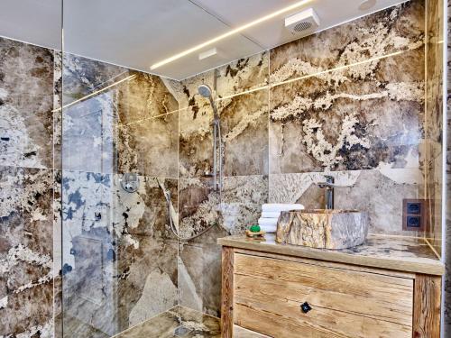 a bathroom with a sink and a shower at Emmat Apartments in Leutasch