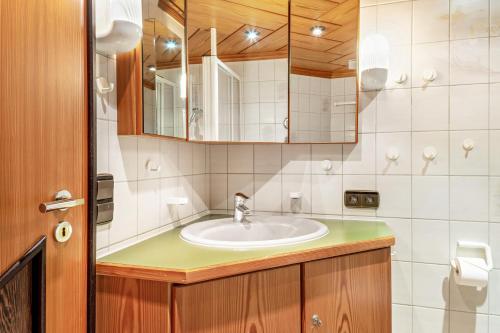 a bathroom with a sink and a mirror at Haus Schmid in Lenzkirch