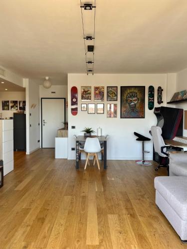 a living room with a table and a couch at 081 Art corner - Milano ovest in Abbiategrasso