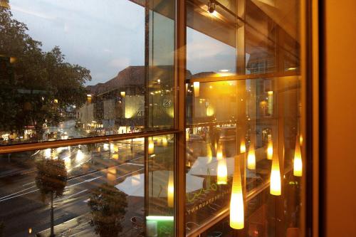 a view of a city street from a window at Hotel Krone ****S in Tübingen