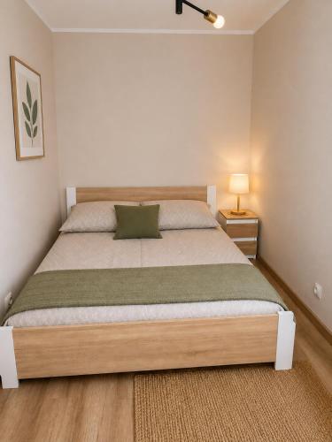 a bedroom with a large bed in a room at Family Spot in Konin