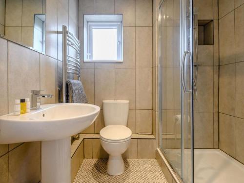 a bathroom with a toilet and a sink and a shower at 1 Bed in Wells oc-88969 in Wells