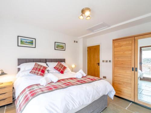 a bedroom with a large bed and a window at 1 Bed in Ripon oc-80303 in Thornton Steward