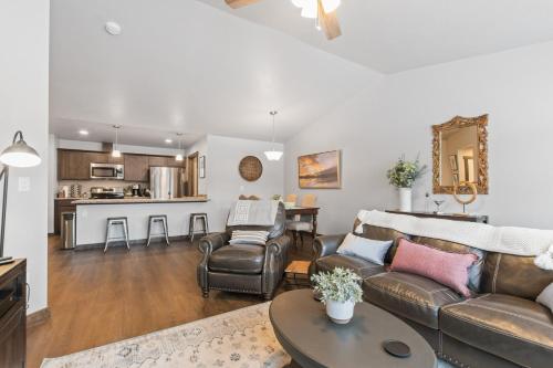 a living room with a couch and a table at Destiny Cove in Kalispell